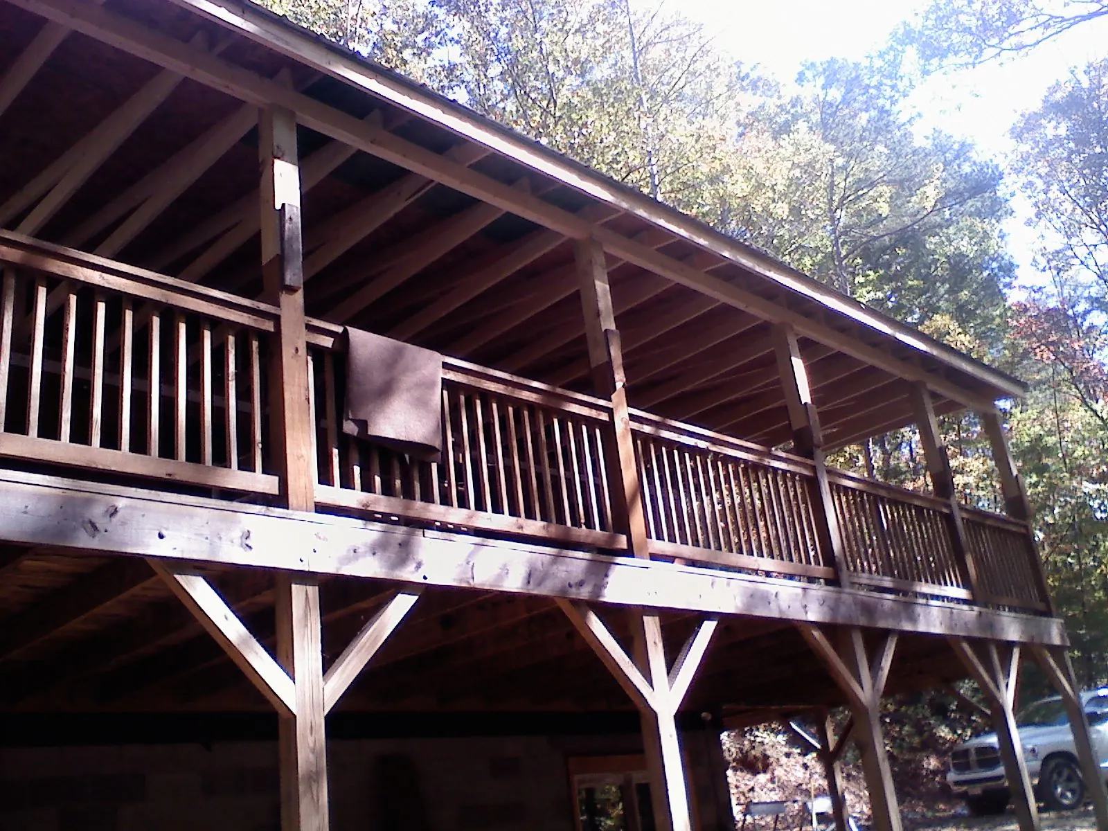 Timber framing under a new elevated porch and deck — Roof Leak Repair in Hesston by Roofing Brothers